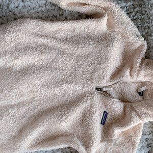 Light pink Patagonia woman’s quarter zip. Size M but fits like an xs/s.
